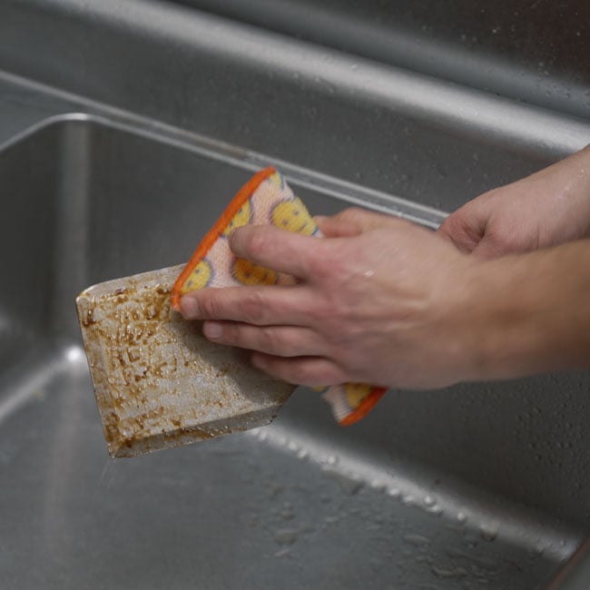 Professional Scour Daddy cleaning utensil in sink