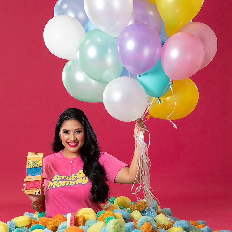 Vanesa holding sponges and balloons